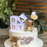 Topo de Bolo para Revelação de Bebê Studio